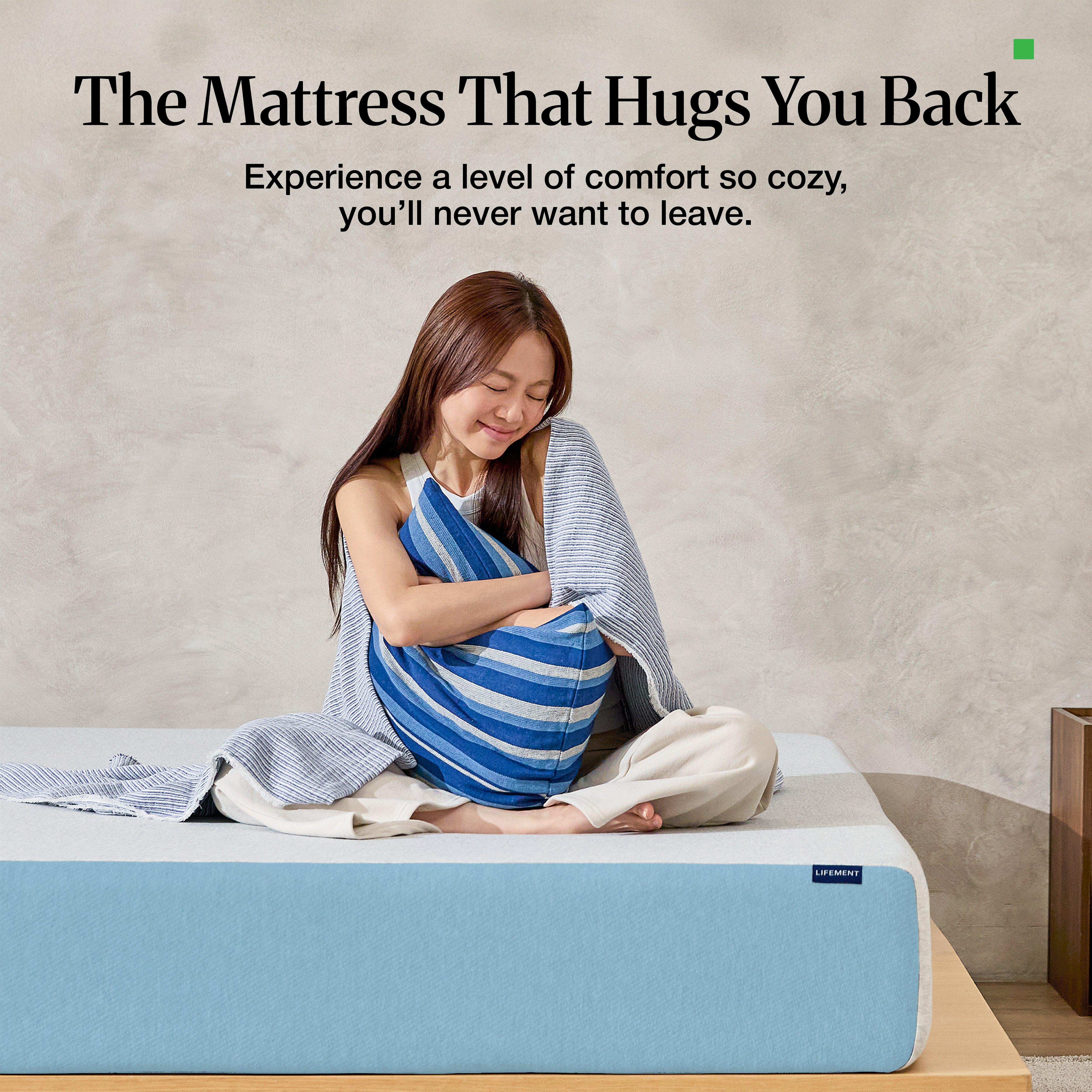 Woman hugging pillow, relaxing on a Lifement Basic Cooling Gel Mattress showcasing plush comfort and support